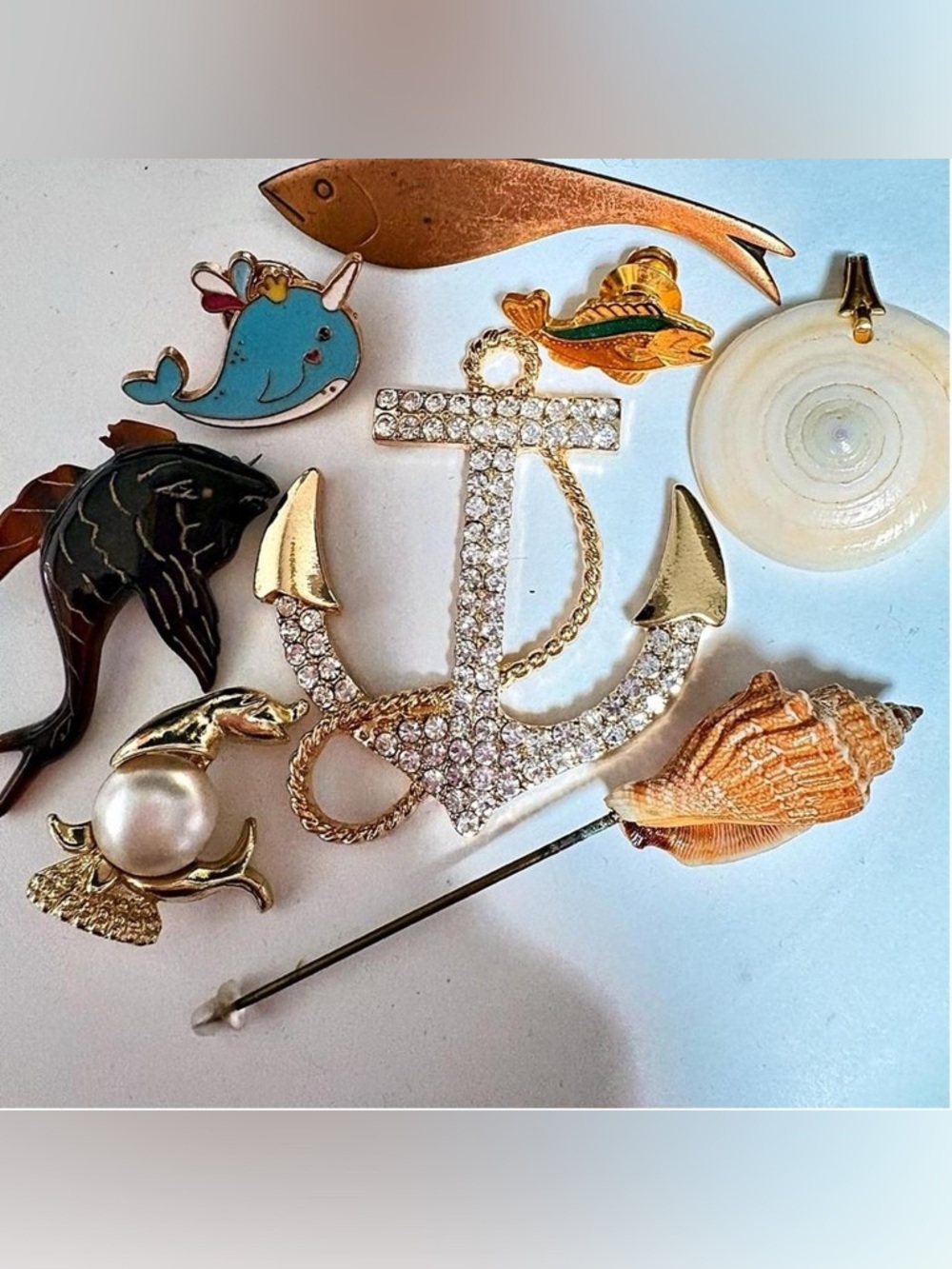 8 Vintage brooches and pendants with modern rhinestone anchor